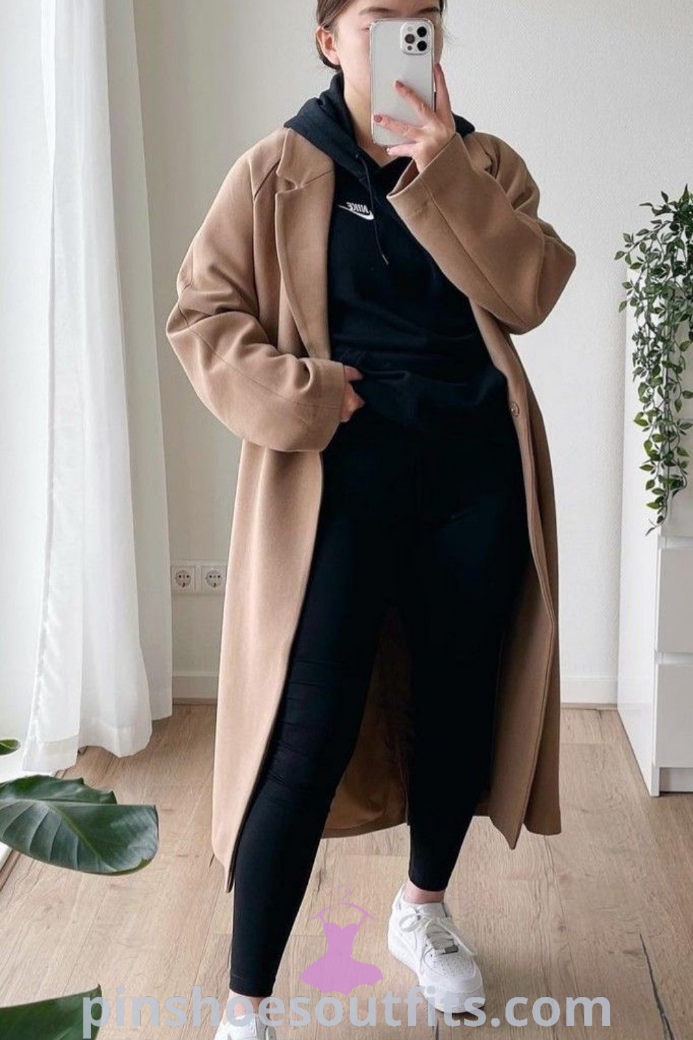 Chic winter business casual outfit combining sweats and a long coat, perfect for cold weather office wear and showcasing trends for Fall 2023 and 2024. This stylish look offers outfit ideas for snowy weather, featuring a casual monochromatic aesthetic. Discover more outfit inspo at pinshoesoutfits.com.