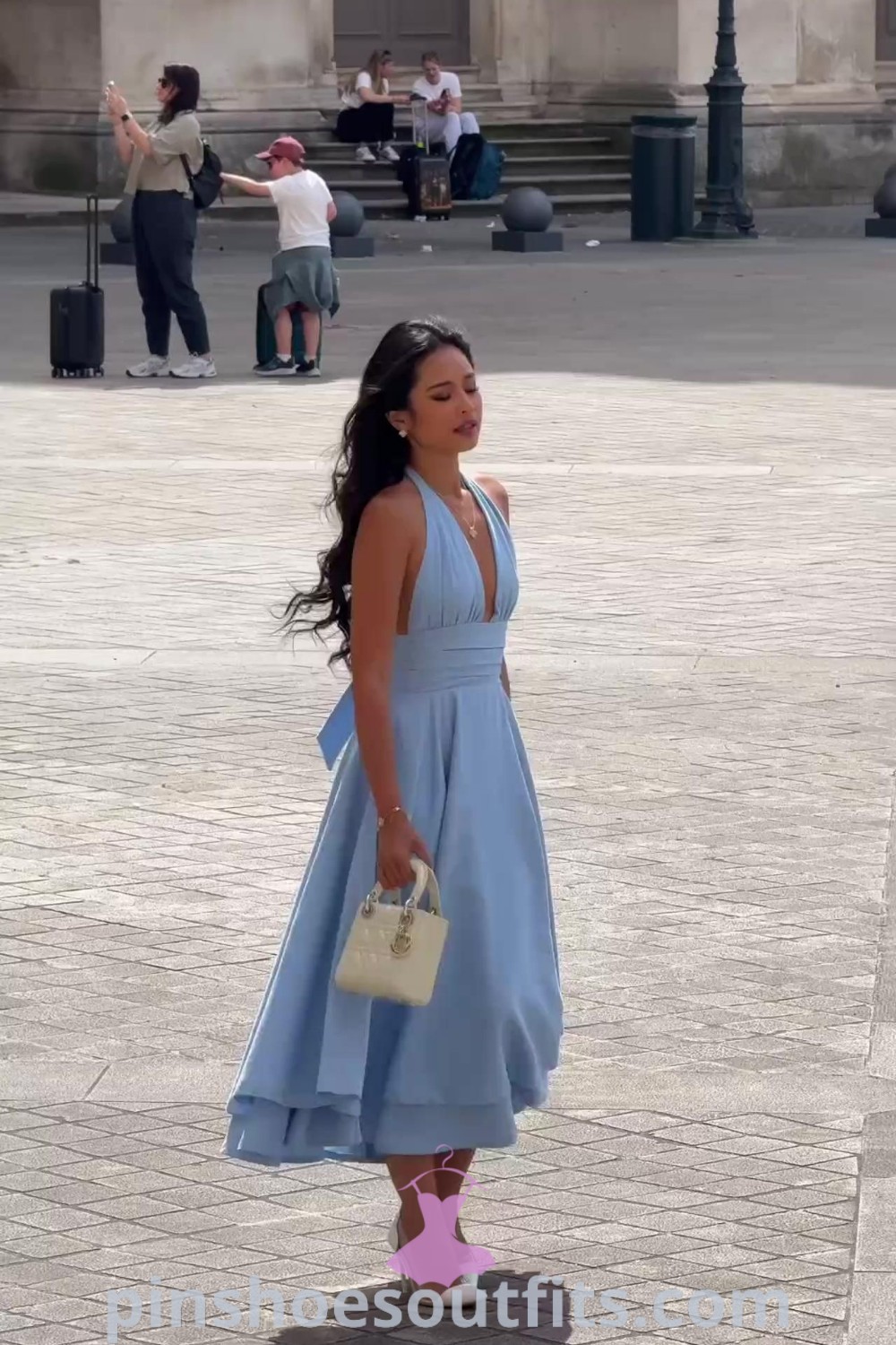 Light blue summer dress outfit featuring a romantic open back and fairy midi design, perfect for stylish summer occasions. Visit pinshoesoutfits.com for outfit ideas that inspire every woman