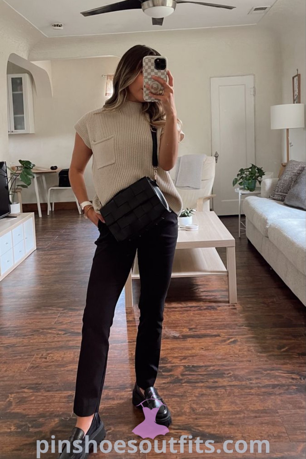 Chic loafers office outfit with a downtown sweater and black slacks, showcasing stylish and comfortable options for professional wear. Perfect combination of loose tops for women and loafers, offering inspiration for fashionable work outfits. Discover more at pinshoesoutfits.com