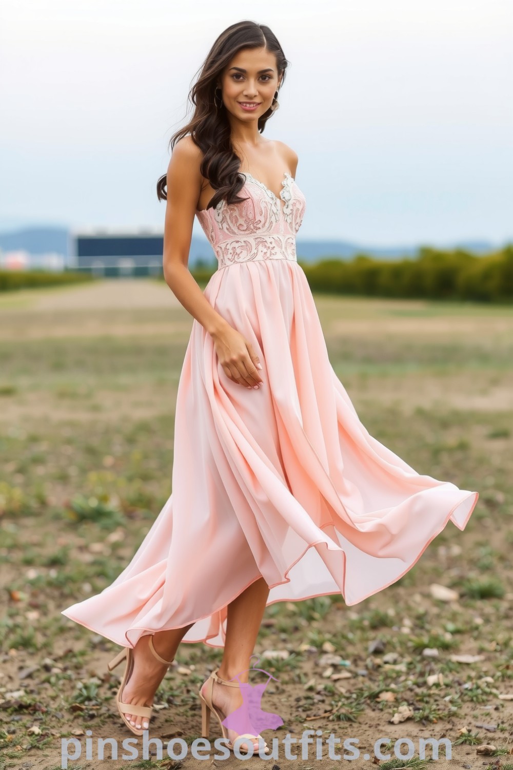 Elegant woman in a flowing blush chiffon midi dress with a fitted lace bodice and pleated skirt, complemented by strappy heeled sandals, perfect for romantic evenings. pinshoesoutfits.com